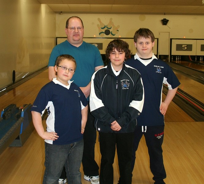Bowlers Dorian Tomlinson (lower left), James Girard, Ryan Zalasky (right), and coach Andr é Langevin were among those in attendance at a wind-up party at Parellel Lanes