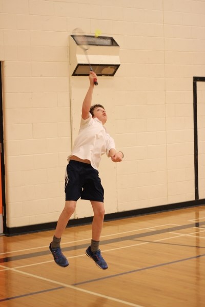 Nathan Dubeau reaches for a shot during the Glen Avon Panthers Invitational Badminton Tournament on Saturday.