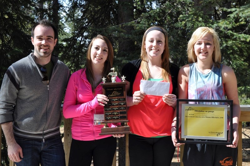 Tri-elle, a three-piece band featuring école du Sommet students (from right) Chloe Corbiere, Danica Chrapko and Elise Lamoureux, accept their first place award at the La