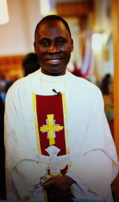 Father Gilbert Dasna, seen here officiating at a local wedding, was killed on Friday night in the St. Paul rectory.