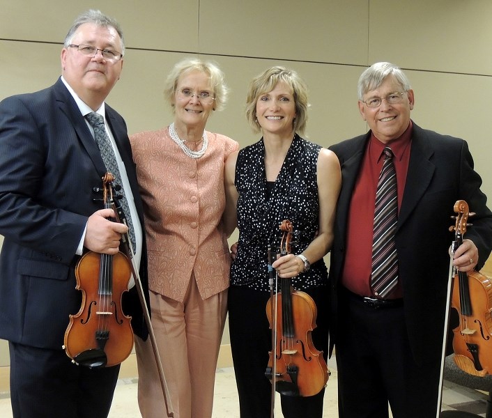 Fiddlers Calvin Vollrath (left), Elizabeth Hubley, Kelli Trottier, and Ivan Hicks were all part of a delegation to the Senate of Canada, looking to establish a National