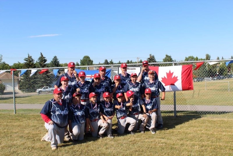 The St. Paul Storm U11 Midget boys baseball team celebrates after winning three of four games at the provincials in Okotoks on July 27. The boys took second place after