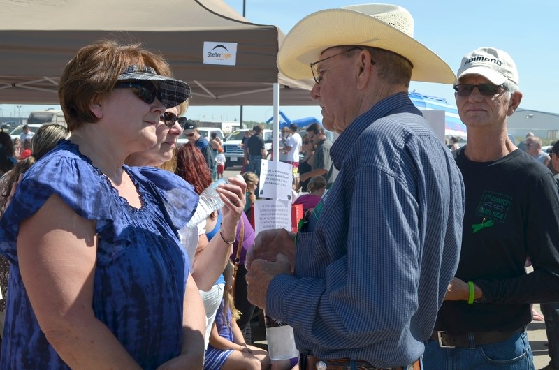 Doris Landry, Brodie&#8217;s grandmother, talks to organ recipients Morris Irvine and Tom Mathews at the charity barbecue and silent action for Brodie Landry last week.