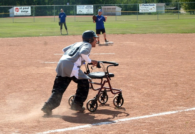David Generoux, with the St. Paul yellow division team, races to first bace after a clever bunt during a game on Saturday. Generoux was one of the participants in the Conrad