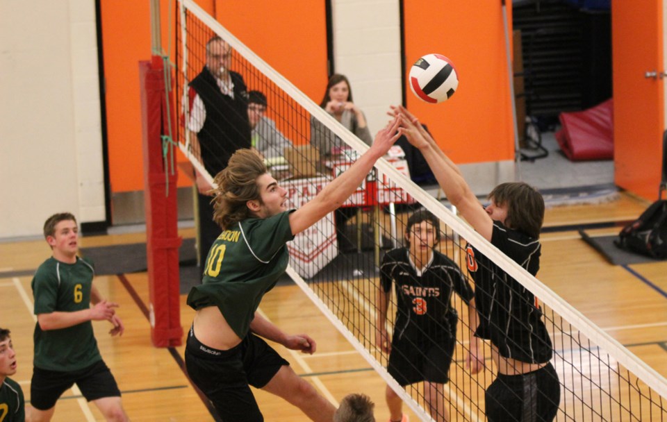 Glendon&#8217;s Carson Doonanco and St. Paul&#8217;s Matthew Skyrpan do battle above the net during the SPAA St. Boys final. The Regional would go on to win the match and