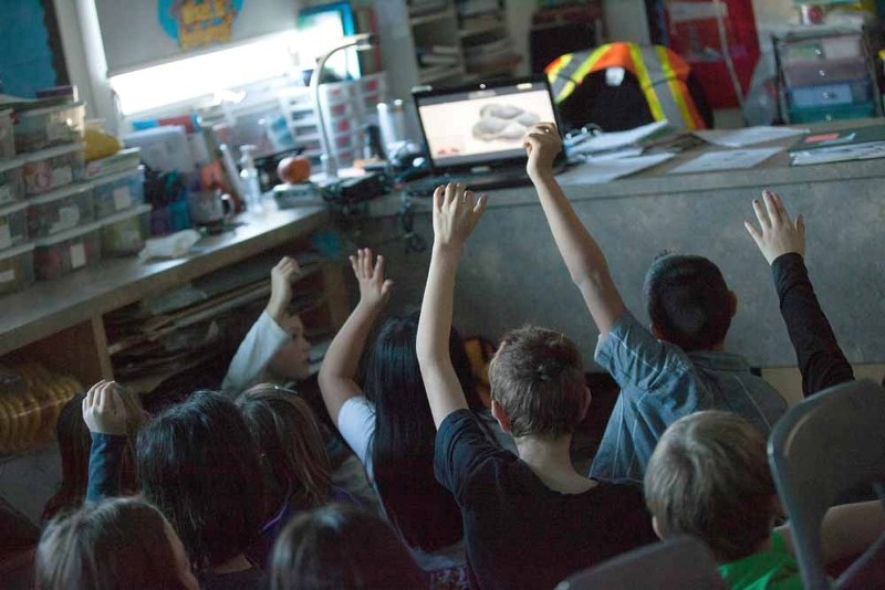 Grade 4 students at St. Paul Elementary School are eager to answer questions being asked by an expert, brought into the class through a virtual field trip with the Royal