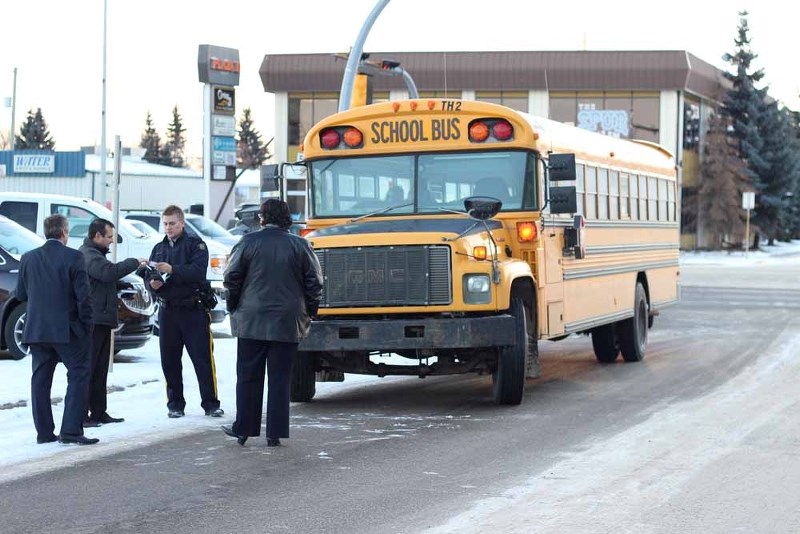 St. Paul Education Regional Division representatives, including Director of Transportation Doug Fedoruk and Superintendent Glen Brodziak speak with RCMP following a minor