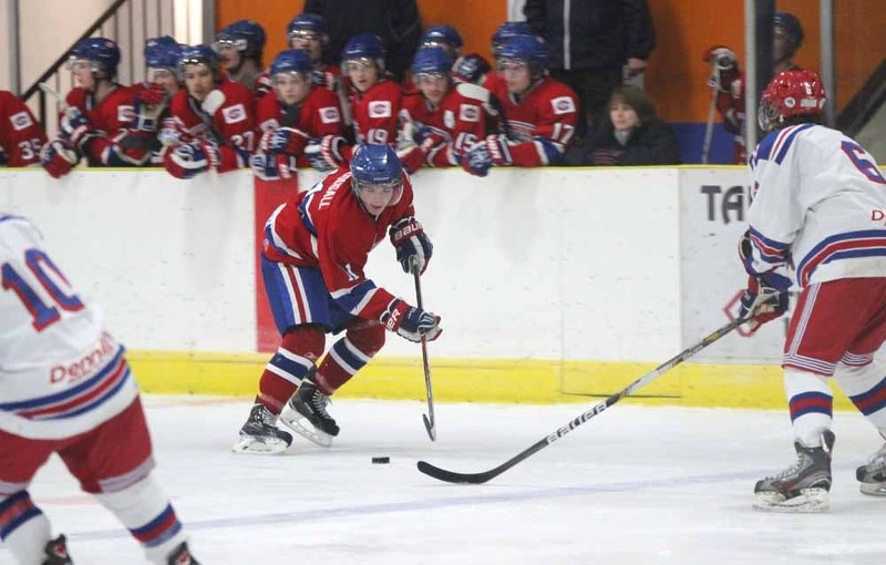 The Canadiens&#8217; Roddy MacDougall tries to start the offensive rush as the bench watches on.