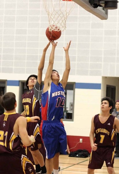 Vilna&#8217;s Trent Delver skies for the rebound against an F.G. Miller opponent during a SPAA basketball game on Dec. 10.