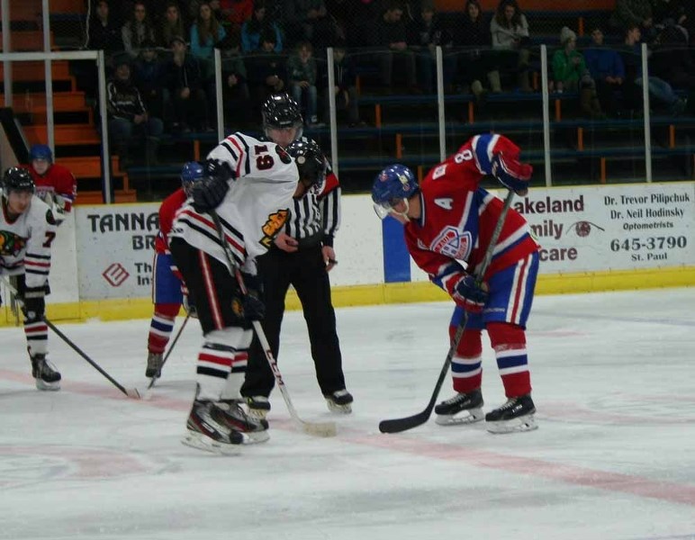 Courtney Cook (left) and Jalel Abougouche get ready for the puck to drop.