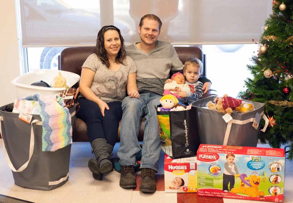 Newborn baby Brielle Potts has claimed the title of being the first baby born in St. Paul in 2015. Pictured is Brielle being held by her brother Ethan, and parents Angela and 