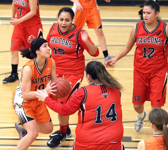 The Regional&#8217;s Madisyn Watt goes up against a crowd of Ashmont defenders during league play on Jan. 7 in St. Paul.