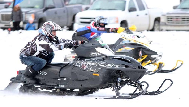 Two racers go neck-and-neck as the finish line approaches during an SSRA snowmobile drag racing event in St. Paul on Jan. 18. A total of 96 racers performed on the day, with