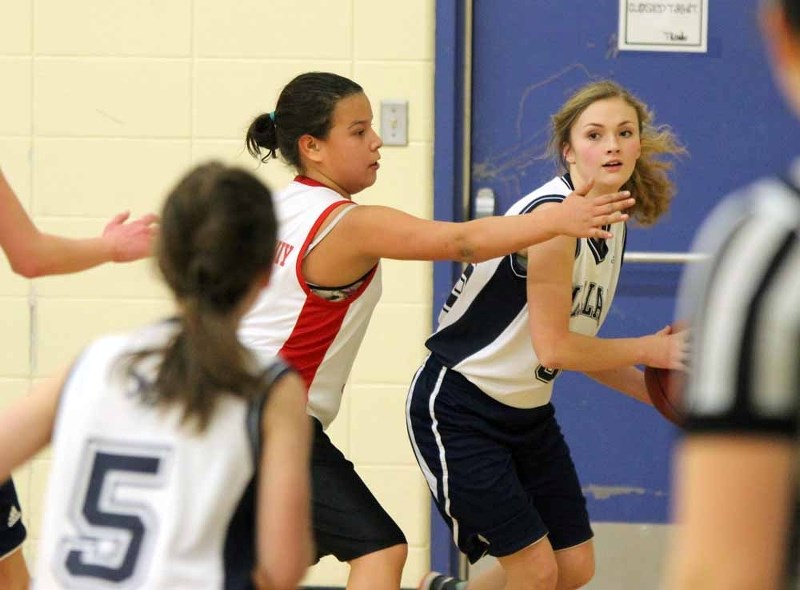 Mallaig&#8217;s Maria Wittmeier saves the ball from going out of bounds while KAEC&#8217;s Allyese Cardinal plays defence.