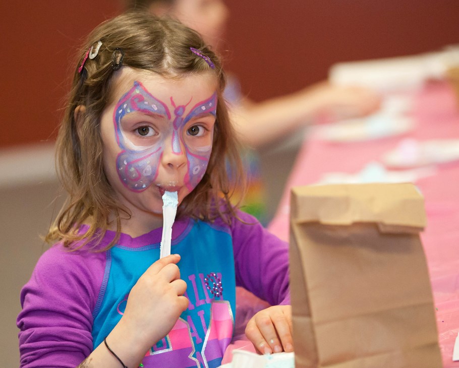 Sarah Leister licks some sweet icing while decorating cookies at the St. Paul Alliance Church during the Spring Fling and Easter Things event, March 29.