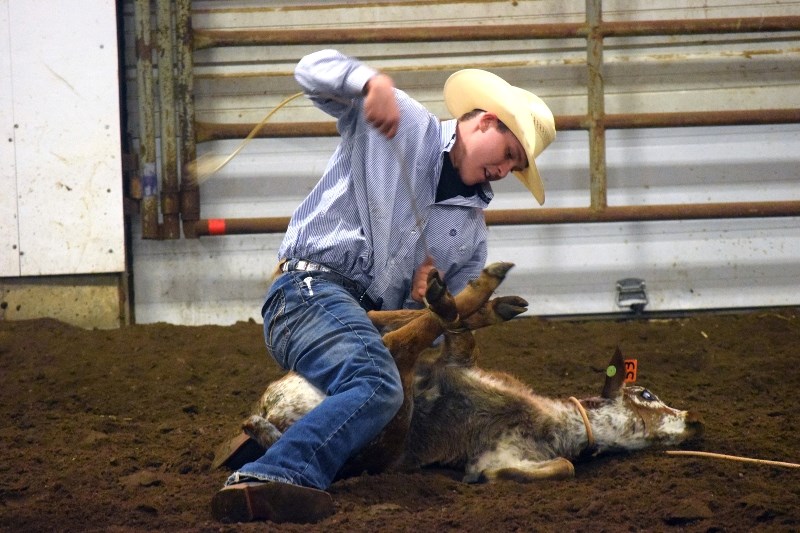 Wyatt Smith handidly finished the tie down roping event at the 2015 Alberta High School Rodeo on April 19 at the AG Corral. Kadon Knapp of Mayerthorpe ultimately won this