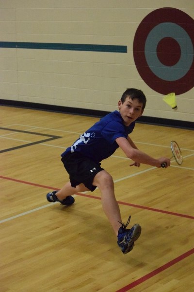 Grade 8 student Daniel Hebert of Racette School went into the splits to return a shot during his semi-final B boys singles matchup at the SPAA badminton championship held at