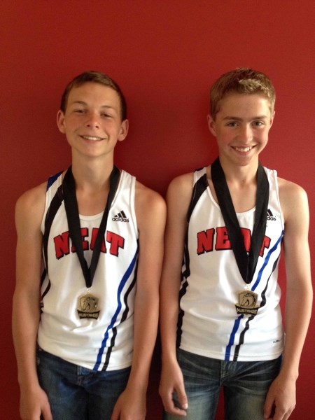 NEAT Track Club members Daniel Hebert (left) and Joshua Foote finished in a first place tie in points at the end of a midget boys pentathlon competition between each other at 