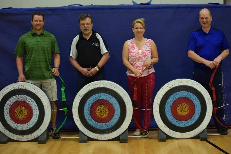 Alain Mah é (left), Karen Chalmers-Beaulieu (second from right) and David Filion (right) are now certified by the National Archery in the School Program as Basic Archery