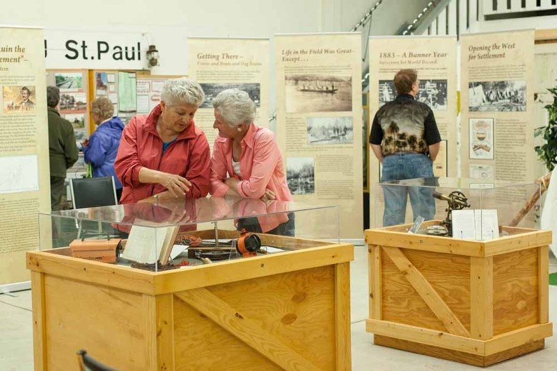 Visitors of the St. Paul museum take time to learn about how surveyors worked and divided land in the early 1900s. A provincial exhibit is now on display at the museum.