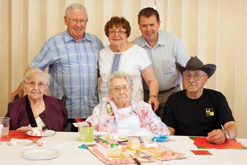 Mary Lukenchuk (sitting middle) was surrounded by family and friends on her 100th birthday, July 19. Pictured is (left back row) her son-in-law Dave Topping, daughter Adeline 