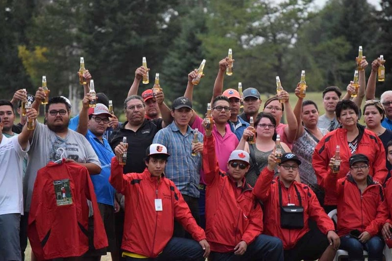 The participants of the first Dallas Steinhauer Memorial Golf Tournament raised their beers to toast Dallas at the conclusion of the tournament on Saturday night at the Vilna 