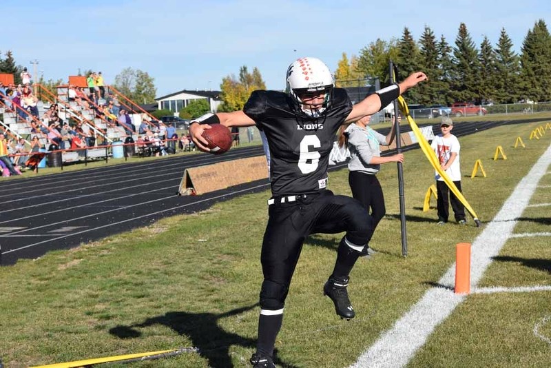 Patrick Dion celebrates his first touchdown of the game against the Lloydminster Barons with a leap in the air. He would add one more in Friday night&#8217;s game at St. Paul 