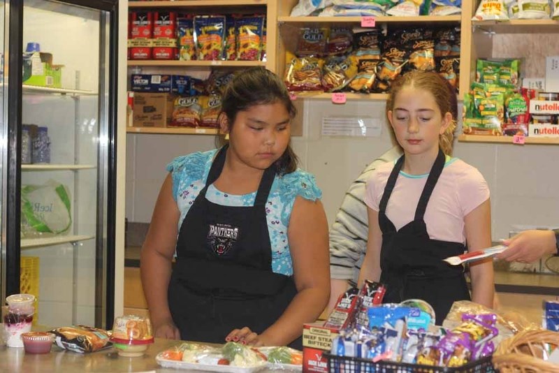 Nathania Nepoose and Bailey Lang are two Glen Avon School students that help out at the school&#8217;s snack bar, which now only offers healthy options to students on their