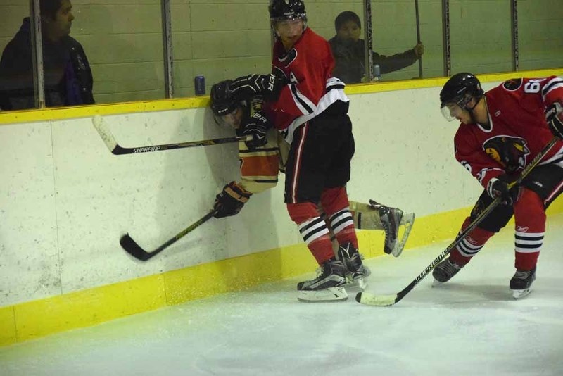 WindyBoy Makokis (left( and Lane Hoff (right) showed some nice teamwork as Makokis took care of the check and Hoff took care of the puck.