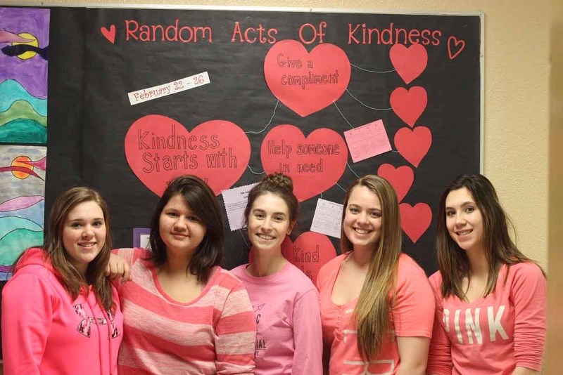 Stephanie Simpson, Tori Youngchief, Allison Christensen, Korri-Lynne Feland and Haley Kwan donned pink shits as part of pink shirt day on Feb. 24 at the school, while also