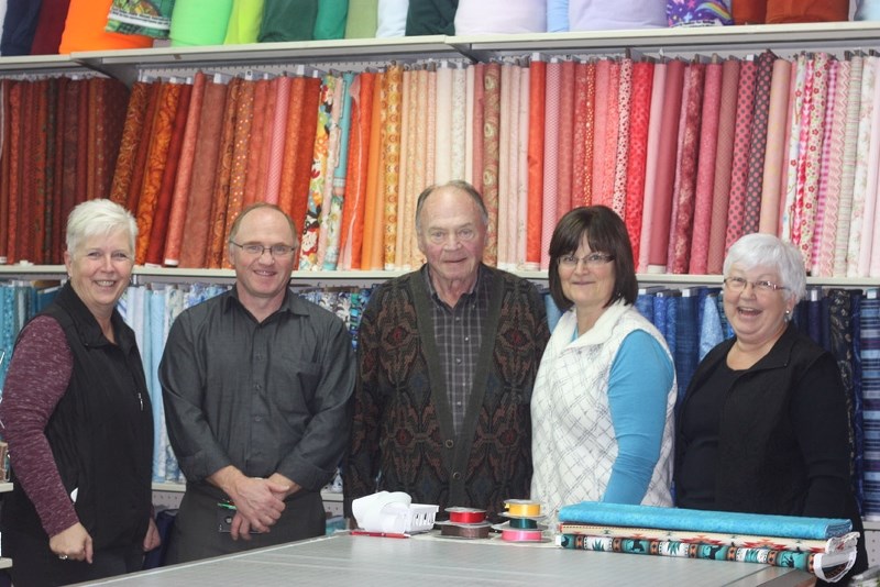 Stedmans staff and owner John Stewart (centre) are preparing to say goodbye to the store they&#8217;ve known and loved for several years.