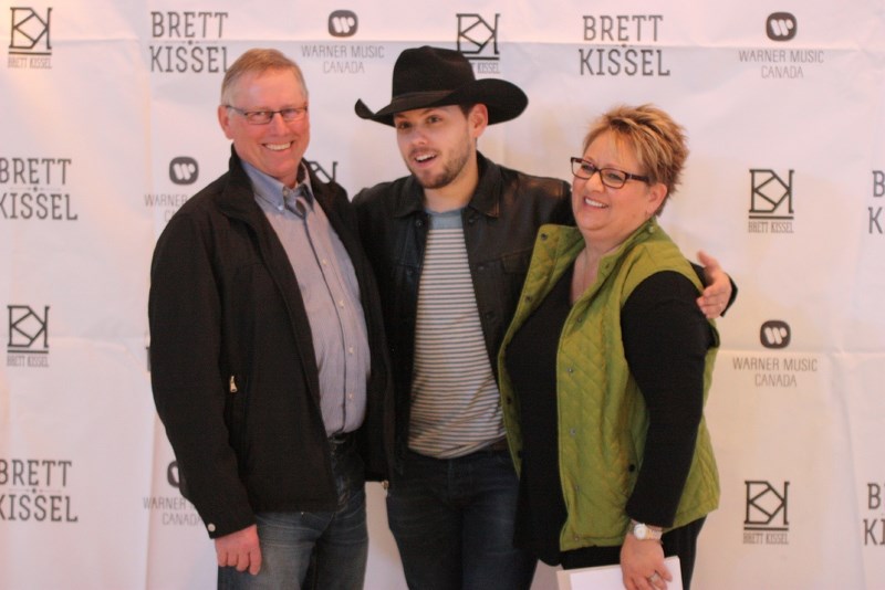Brett Kissel stands with his parents Gordon and Brenda during the announcement of his hometown concert. The announcement took place at the All Saints Ukrainian Cultural