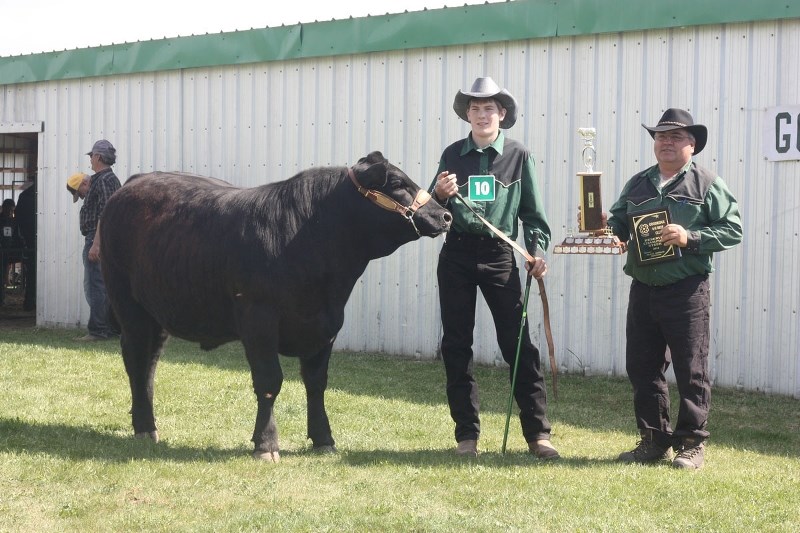 Stephanie Bilodeau showed Goodridge&#8217;s grand champion steer, while Sheldon Kwiatkowski(far left) took reserve champion honours.