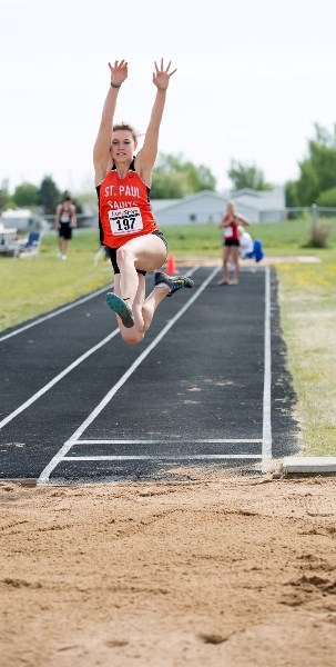 St. Paul Regional&#8217;s Madison Trottier pushes for a jump at last Wednesday&#8217;s S.P.A.A. Senior High Track and Field meet. Trottier placed first in the Senior Girls