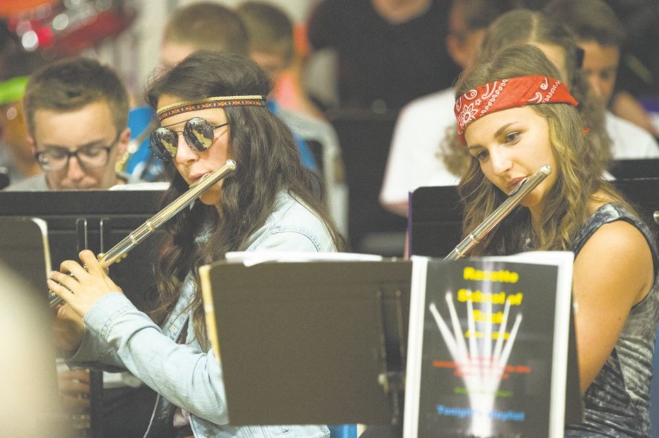 Students from Racette Jr. High School embraced the Rock and Roll theme of the school&#8217;s band concert on June 2, with Sydney Bespalko and Taylor Fedoruk among the