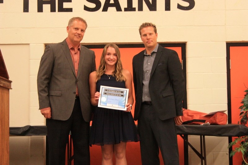 Courtney Hebert accepts her Female Athlete of the Year award. Presenting is Hank Smid and Brandon Strocki.