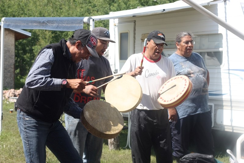 A group of drummers launch into a Happy Birthday song for culture camp lead and Blue Quills university president Vincent Steinhauer at Blue Quills&#8217; annual culture camp, 