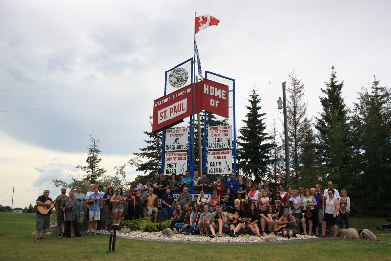 Fiddle master Calvin Vollrath was joined by the participants at his annual fiddle camp during a sign dedication in the Town of St. Paul. The town&#8217;s welcome signs