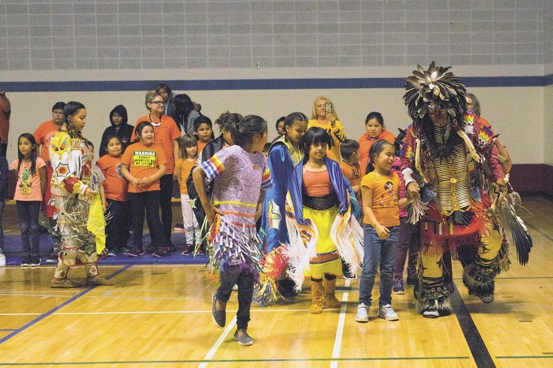 Vilna School held an event last Friday for Orange Shirt Day, which included guest speakers and dancers such as Fred Scanie, seen here with the students of the school.