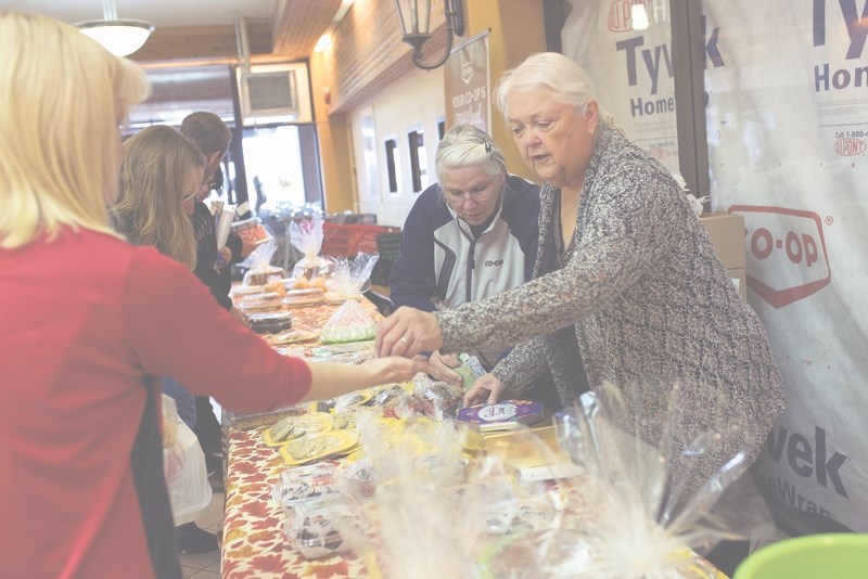 Louis DeChamplain had a busy day selling baked goods on Oct. 6 in support of a local family with a baby who has been diagnosed with stage IV cancer.