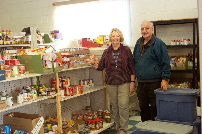 Food bank chair Larry Lambert and his wife Louise were hard at work last week, making sure the shelves were stocked for new clients that accessed the services that day.