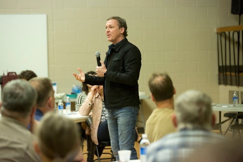 Doug Griffiths speaks to a gym full of people on Thursday night, at Portage College.