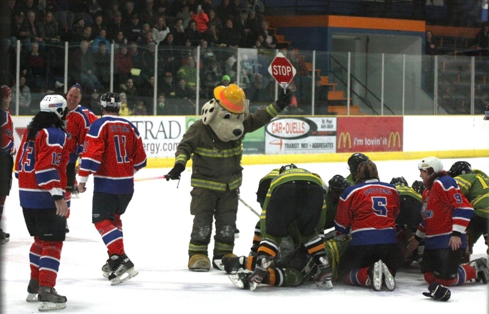 Sparky, the St. Paul Fire Department Mascot, was on hand to try and put a stop to the madness when the St. Paul Fire Department got into a fight with the visiting CFCW