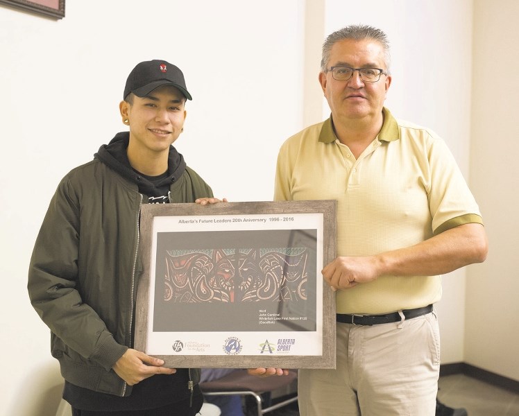 John Cardinal is pictured here with Rick Janvier of Tribal Chiefs. Cardinal is from Whitefish Lake and has been successful in getting exposure for his colourful art.