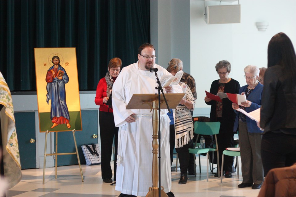 Christopher Cook of the St. Paul Anglican Church does a reading during the Jan. 18 to 25 dates designated as the Week of Prayer, for Christian unity. He was among the readers 