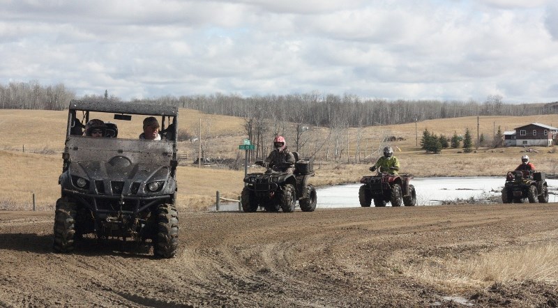 Participants in Saturday&#8217;s Ashmont quad rally ride into the trail&#8217;s midway point.