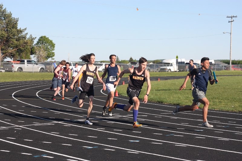 Chris Michaud and Matthew Hawiuk compete for the Saints at zones last week. Hawiuk would be among the athletes advancing to provincials, where he won a gold medal over the