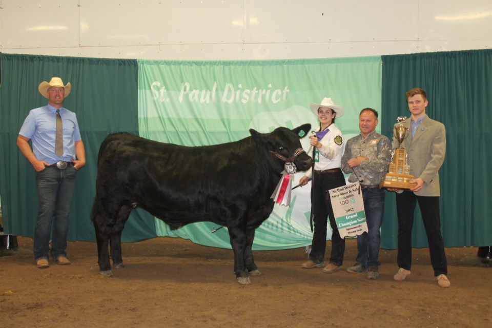 Taylor Dechaine of St. Lina 4-H Beef Club showed the Grand Champion at the St. Paul District 4-H Market Steer Show and Sale. This week&#8217;s Journal has full coverage of