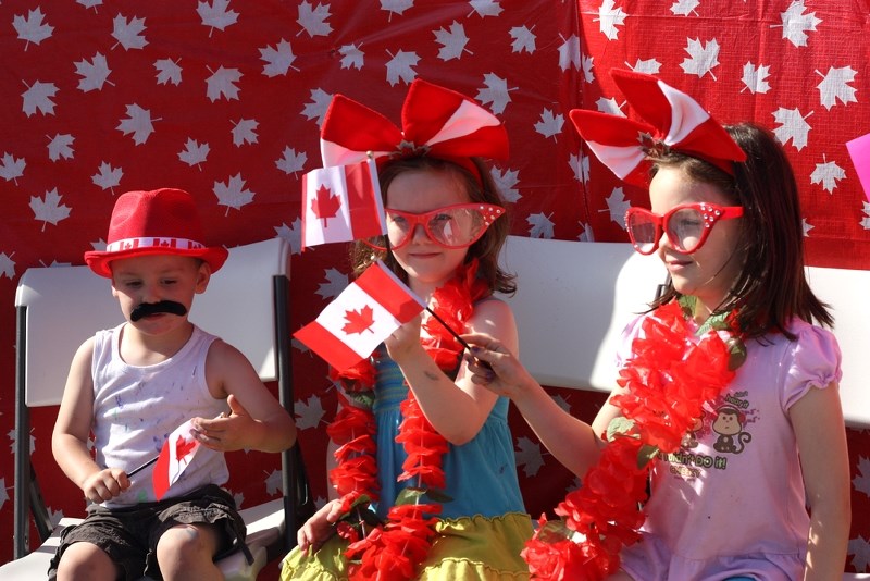 Austin, Elizabeth and Emberlie Anderson celebrate Canada Day at the Alliance Church&#8217;s On the Way to Canada Day event, June 25. A long list of events will be keeping