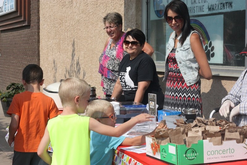 Volunteers with the St. Paul Animal Shelter sell taco in a bag as a fundraiser during last week&#8217;s Rock the Block event, in St. Paul.